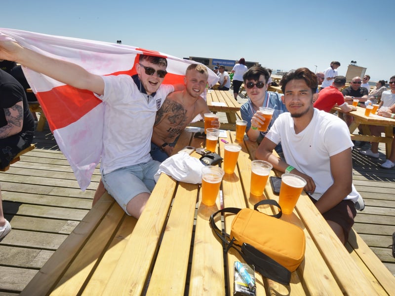 Football fans getting ready to watch England V Croatia at the Bier Garden on Hastings Pier. SUS-210614-070901001