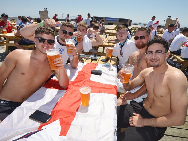 Football fans getting ready to watch England V Croatia at the Bier Garden on Hastings Pier. SUS-210614-070926001