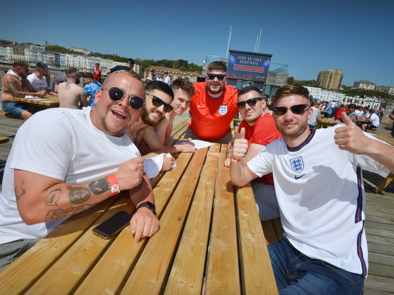 Football fans getting ready to watch England V Croatia at the Bier Garden on Hastings Pier. SUS-210614-071159001