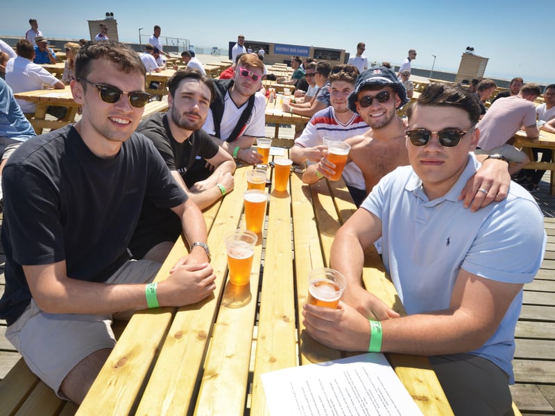 Football fans getting ready to watch England V Croatia at the Bier Garden on Hastings Pier. SUS-210614-070914001