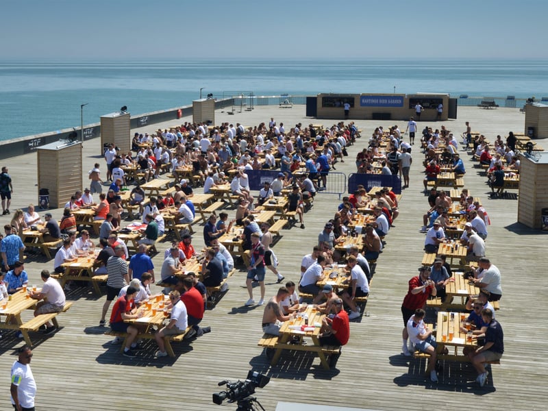 Football fans getting ready to watch England V Croatia at the Bier Garden on Hastings Pier. SUS-210614-071220001