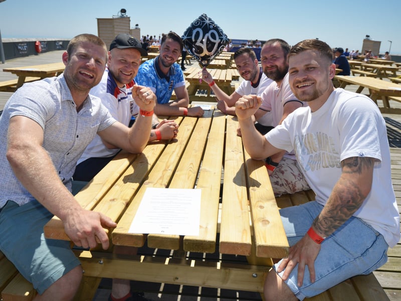 Football fans getting ready to watch England V Croatia at the Bier Garden on Hastings Pier. SUS-210614-071240001