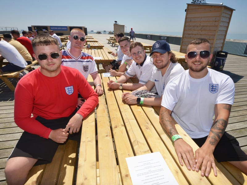Football fans getting ready to watch England V Croatia at the Bier Garden on Hastings Pier. SUS-210614-070950001