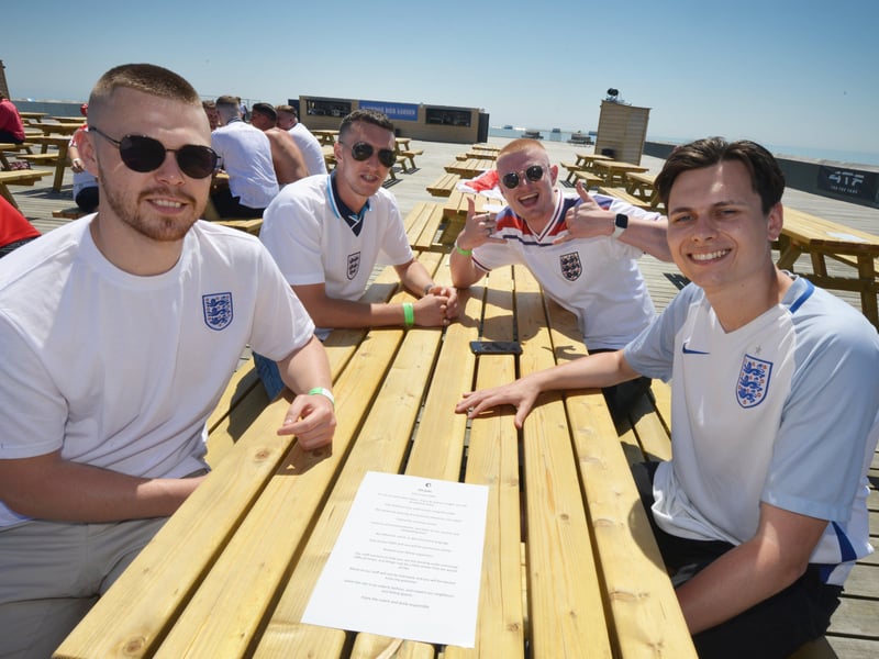 Football fans getting ready to watch England V Croatia at the Bier Garden on Hastings Pier. SUS-210614-071003001