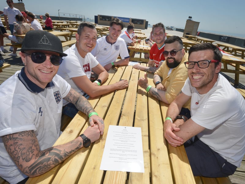 Football fans getting ready to watch England V Croatia at the Bier Garden on Hastings Pier. SUS-210614-071015001