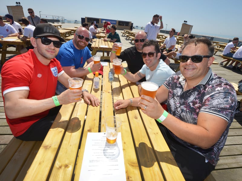 Football fans getting ready to watch England V Croatia at the Bier Garden on Hastings Pier. SUS-210614-071040001