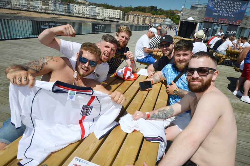 Football fans getting ready to watch England V Croatia at the Bier Garden on Hastings Pier. SUS-210614-070003001