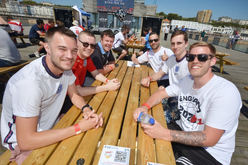 Football fans getting ready to watch England V Croatia at the Bier Garden on Hastings Pier. SUS-210614-070030001