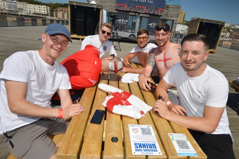Football fans getting ready to watch England V Croatia at the Bier Garden on Hastings Pier. SUS-210614-070256001