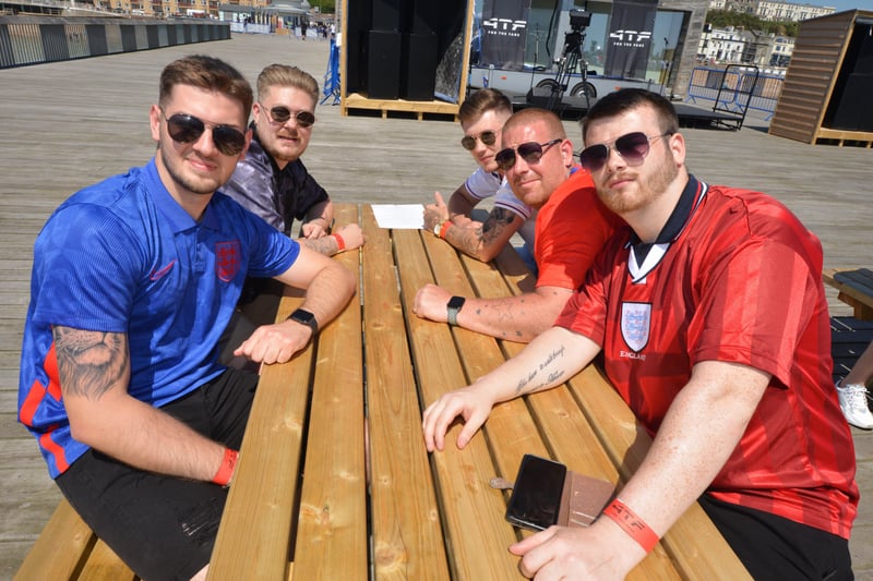 Football fans getting ready to watch England V Croatia at the Bier Garden on Hastings Pier. SUS-210614-070120001