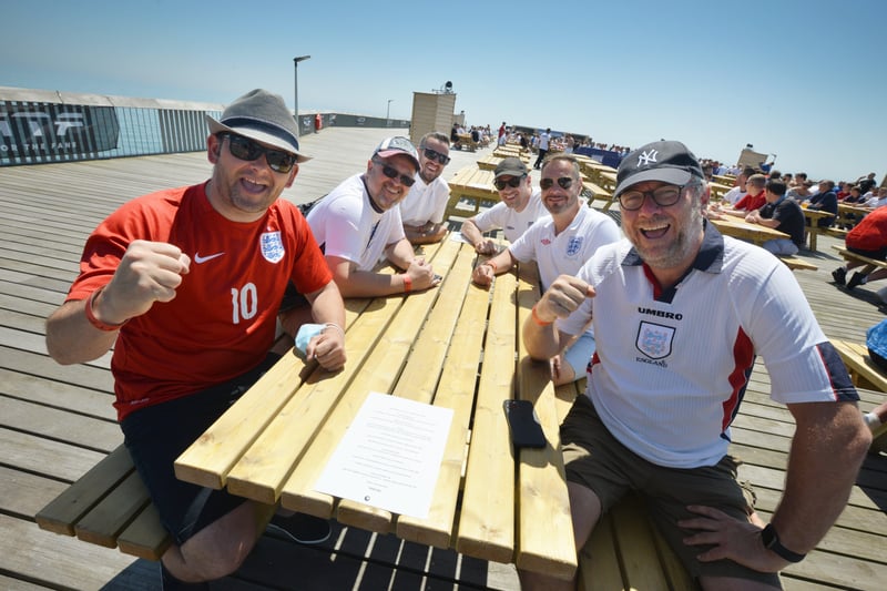 Football fans getting ready to watch England V Croatia at the Bier Garden on Hastings Pier. SUS-210614-070326001