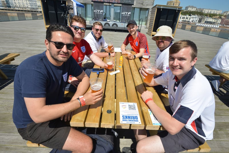 Football fans getting ready to watch England V Croatia at the Bier Garden on Hastings Pier. SUS-210614-070311001