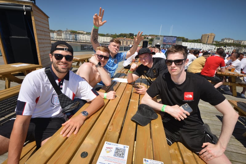 Football fans getting ready to watch England V Croatia at the Bier Garden on Hastings Pier. SUS-210614-070446001