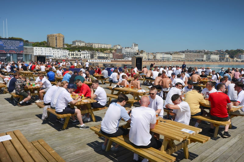 Football fans getting ready to watch England V Croatia at the Bier Garden on Hastings Pier. SUS-210614-070459001