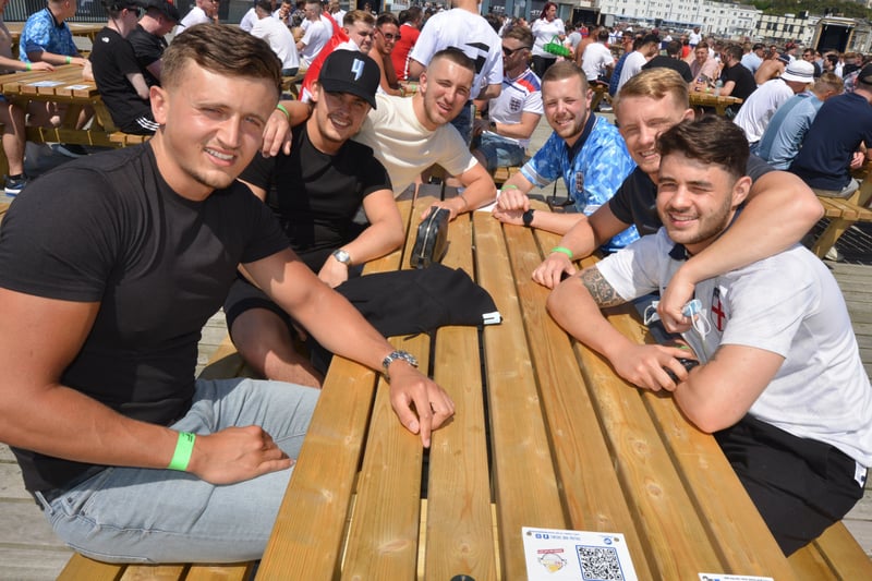 Football fans getting ready to watch England V Croatia at the Bier Garden on Hastings Pier. SUS-210614-070432001