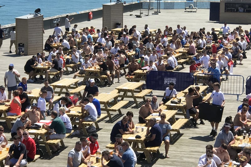 Football fans getting ready to watch England V Croatia at the Bier Garden on Hastings Pier. SUS-210614-070551001