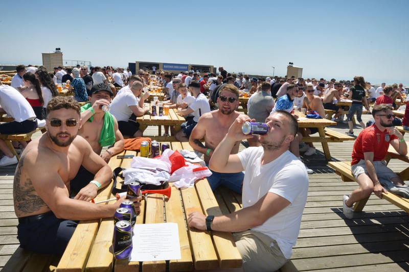 Football fans getting ready to watch England V Croatia at the Bier Garden on Hastings Pier. SUS-210614-070525001