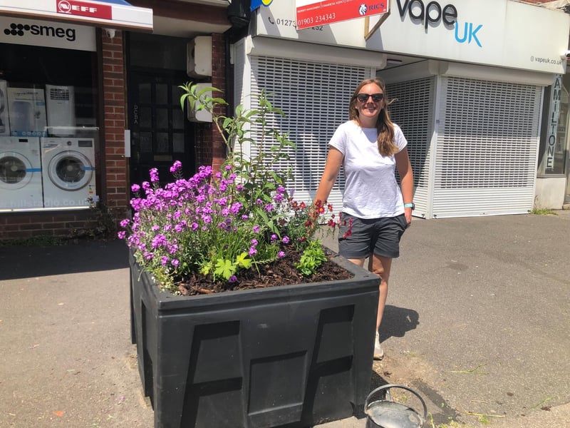 Kate Bradbury, who has appeared on Springwatch and Gardeners World, next to the planter she helped to revive at the weekend