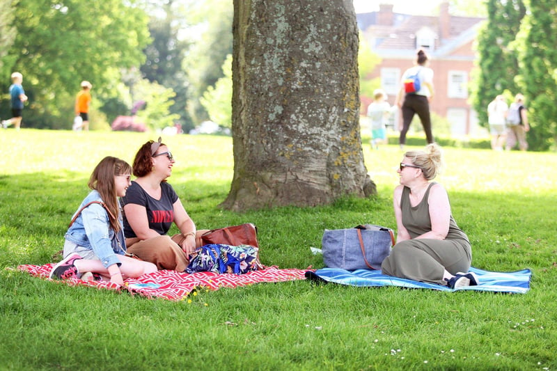 People enjoying sunny weather in Horsham Park. Photo by Derek Martin Photography. SUS-210206-154406008