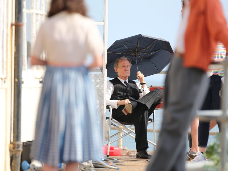 Bill Nighy was filming at Worthing Lido this week. Other actors were seen wearing what looked to be 1950s clothing.