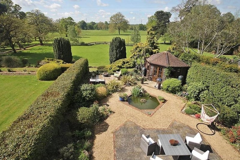 Charming landscaped garden has space for entertaining as well as activities.