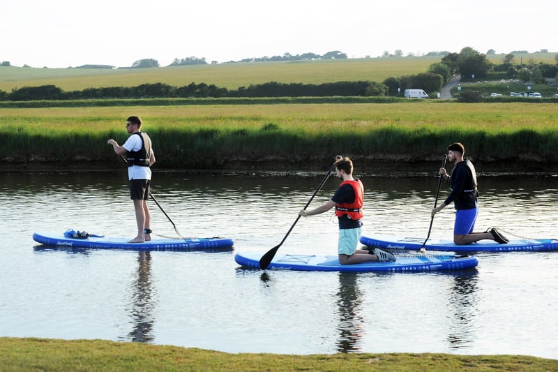 Paddleboarding at Cuckmere Haven (Photo by Jon Rigby) SUS-210616-102944001