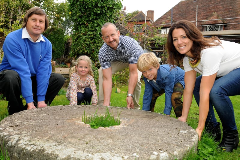 Michael and Lucy Bradly and their children Archie and Holly found an original mill stone in their garden and donated it to Simon Potter (left) in 2014 after Jack and Jill Windmills Society had one stolen. Picture: Steve Robards.