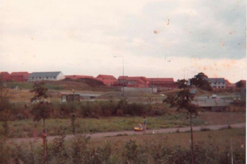 Bradville was built on a scenic spot, with a section of the Grand Union Canal and the old railway walk running through it. Here, you can see the estate being built, with Monks Way in the background, obscured by trees.