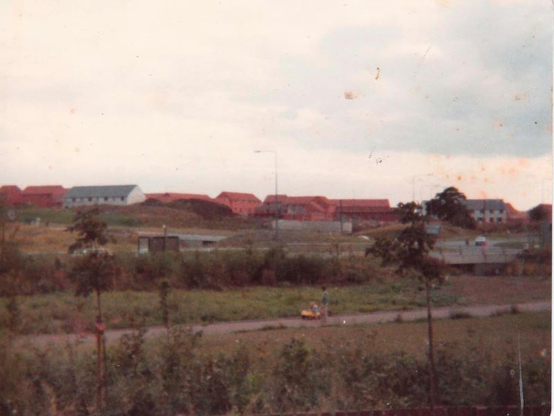 Bradville was built on a scenic spot, with a section of the Grand Union Canal and the old railway walk running through it. Here, you can see the estate being built, with Monks Way in the background, obscured by trees.