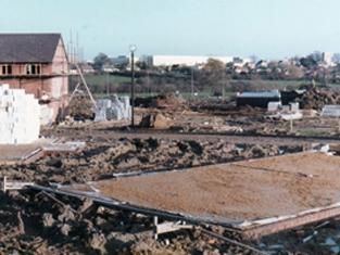 Great Holm was a later estate, with building beginning in 1982. Before this, it had been farmland in the parish of Loughton. Here you can see the early stages of houses being built,