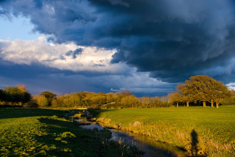 Stormy weather over the River Arun floodplain at Knepp. Photo: Charlie Burrell
