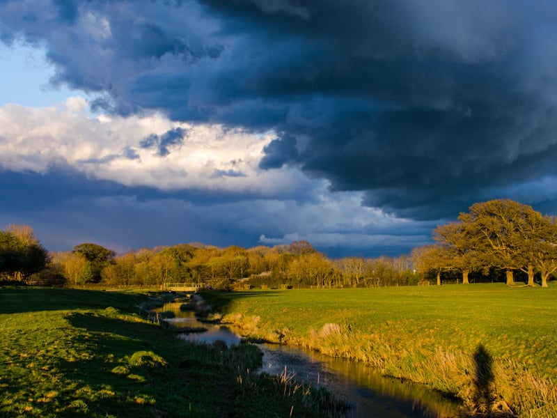 Stormy weather over the River Arun floodplain at Knepp. Photo: Charlie Burrell