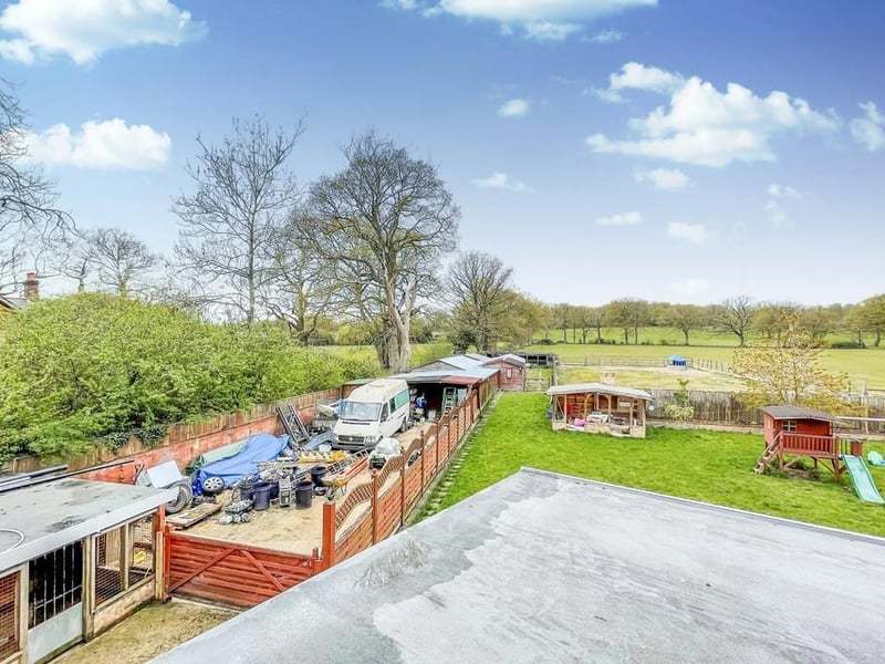 The property has various outbuildings