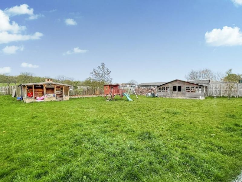 There are huge grounds with various outbuildings