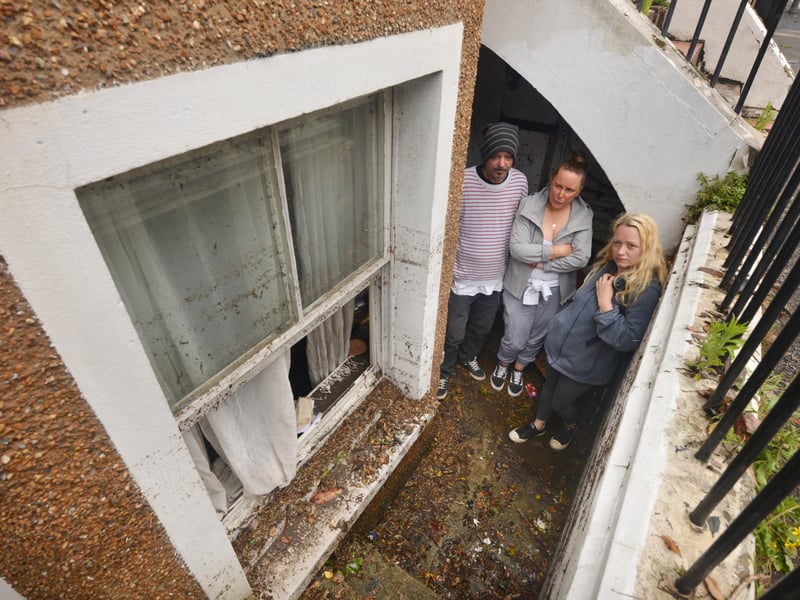 Basement area of a property in South Terrace, Hastings, flooded during a storm on 16/6/21.
Property owner Sarah Lake, centre, with tenants David Lee and Flora Storm. SUS-210617-135751001