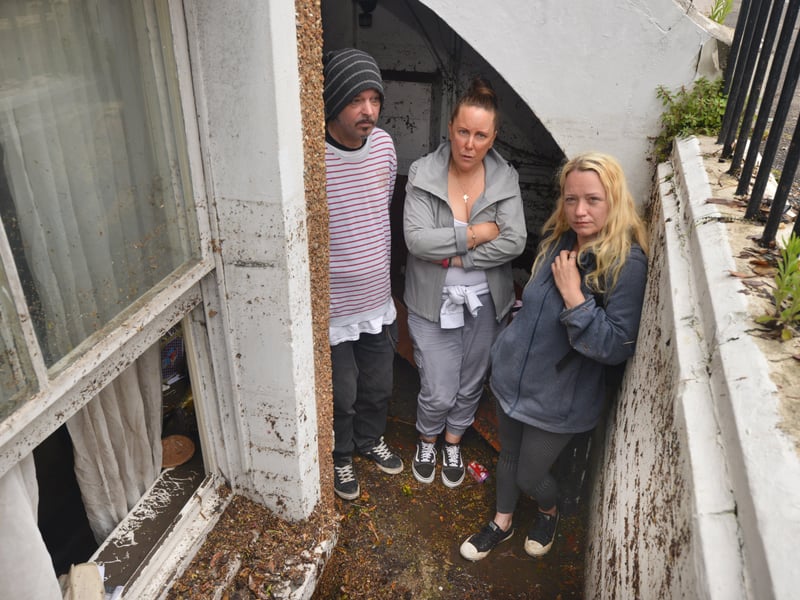 Basement area of a property in South Terrace, Hastings, flooded during a storm on 16/6/21.Property owner Sarah Lake, centre, with tenants David Lee and Flora Storm. SUS-210617-135949001