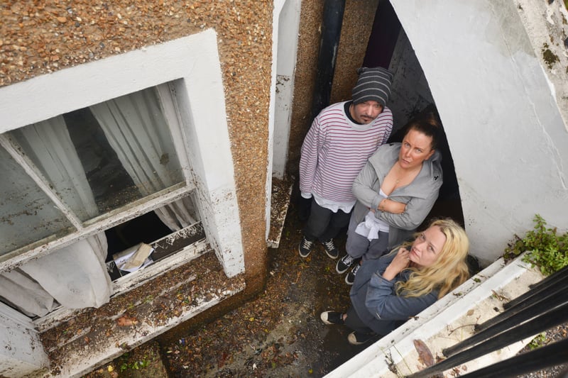 Basement area of a property in South Terrace, Hastings, flooded during a storm on 16/6/21.

Property owner Sarah Lake, centre, with tenants David Lee and Flora Storm. SUS-210617-140138001