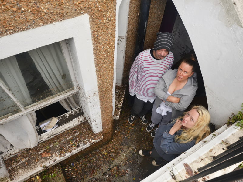 Basement area of a property in South Terrace, Hastings, flooded during a storm on 16/6/21.
Property owner Sarah Lake, centre, with tenants David Lee and Flora Storm. SUS-210617-140138001