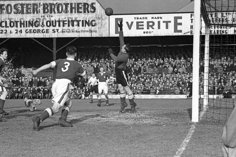 5-5 home draw with Leicester in the FA Cup 1949.  Dog on the pitch