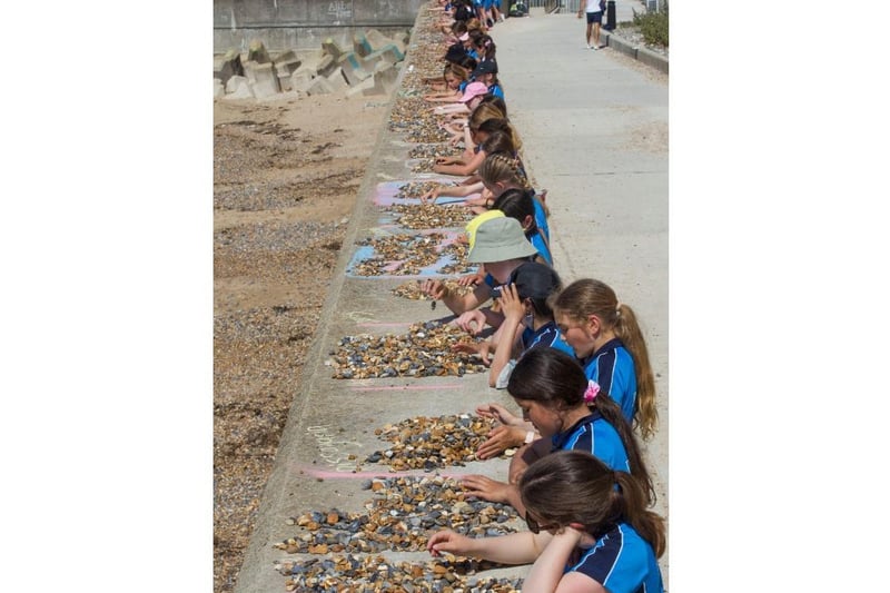 The Roedean year 7 girls laid out a total of 127,917 pebbles along the undercliff sea wall