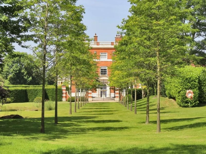 The delightful gardens have both formal elements, with terraced lawns, mellow stone paths and steps with brick retaining walls forming a backdrop for the colourful flowerbeds, and informal areas with shrubs and ornamental/specimen trees.