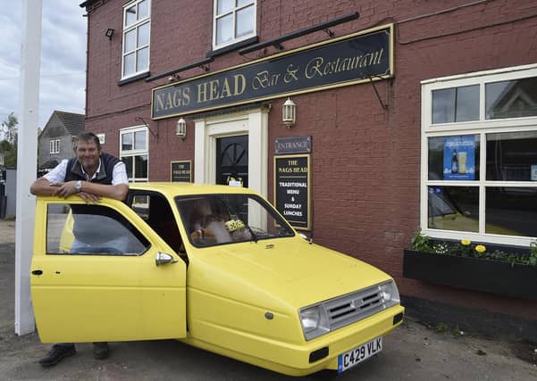Nags Head pub, Eastrea proprietor Richard Owen with his Only Fools and Horses themed pub EMN-210622-154107009