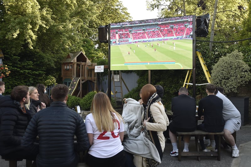 England fans watching the Czech Republic game at The Deeping Stage, Market Deeping. EMN-210622-212344009