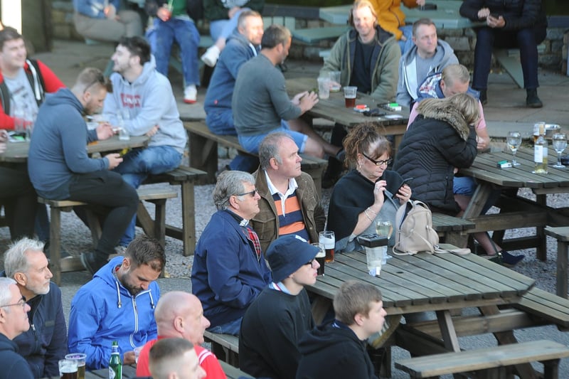 England fans watching the Czech Republic game at The Deeping Stage, Market Deeping. EMN-210622-212256009