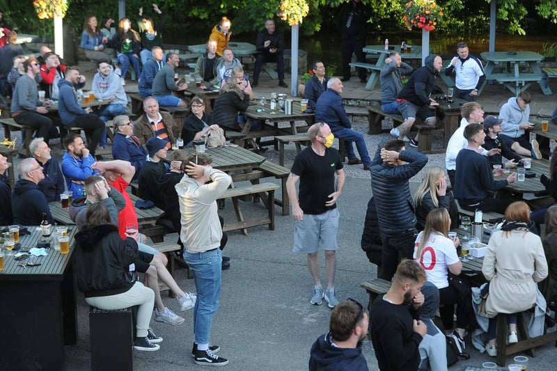England fans watching the Czech Republic game at The Deeping Stage, Market Deeping. EMN-210622-212308009