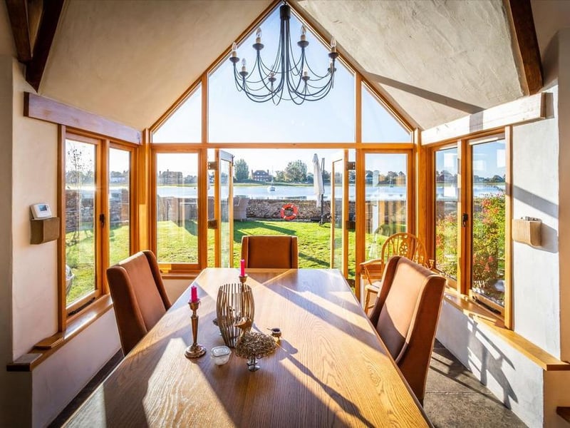 The dining area boasts southerly views out to the harbour.