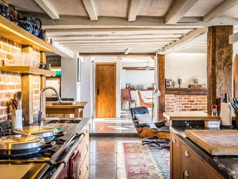 The kitchen design fits in with the period theme of the home.