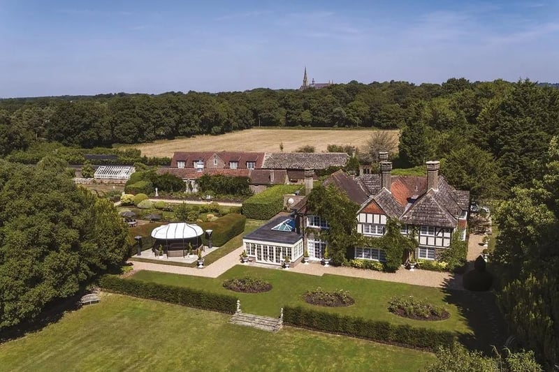 This 17th Century Manor House in Shermanbury is fine family home of considerable character with its own stables.
It has a guide price of £6,950,000.