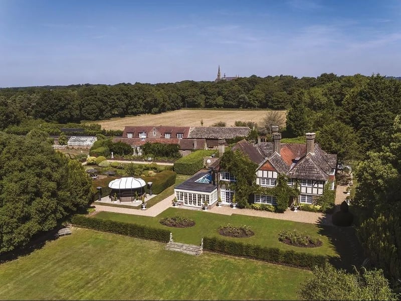 This 17th Century Manor House in Shermanbury is fine family home of considerable character with its own stables.
It has a guide price of £6,950,000.