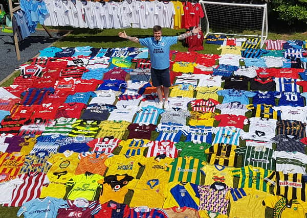 Pete with his collection of shirts.